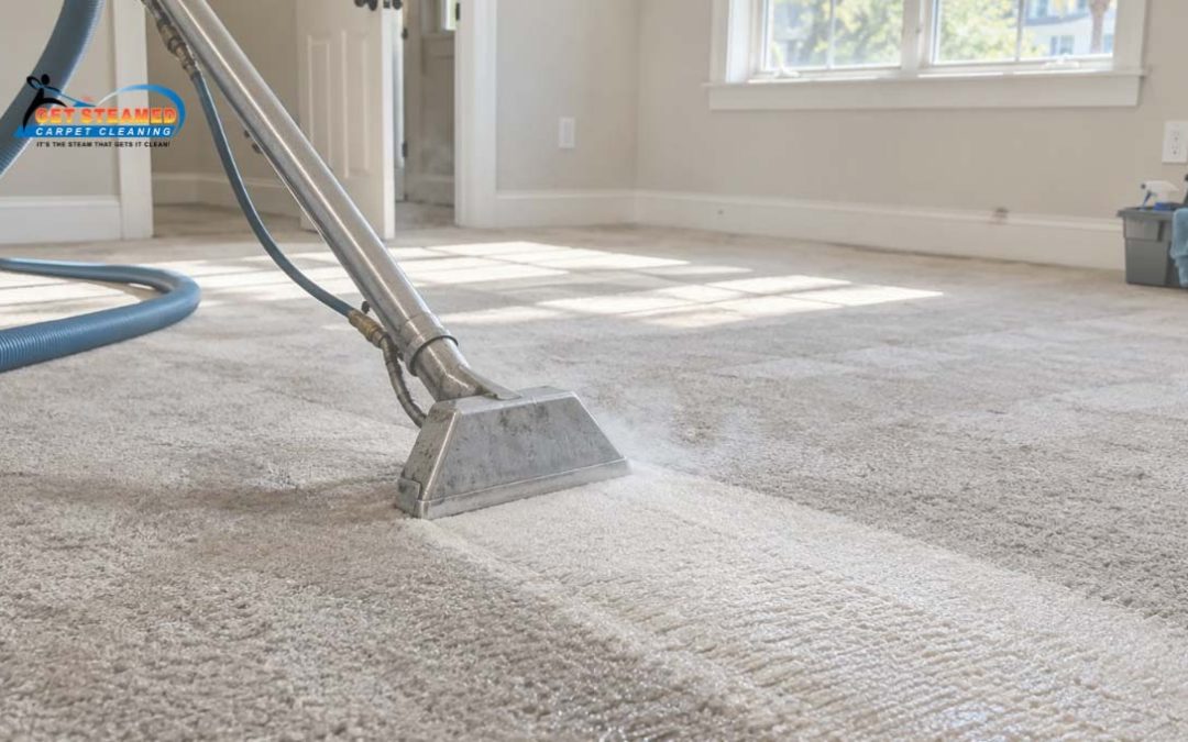 Technician steam cleaning carpet in an empty Charleston apartment between tenants